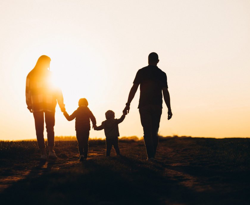 Happy family silhouette on the sunset